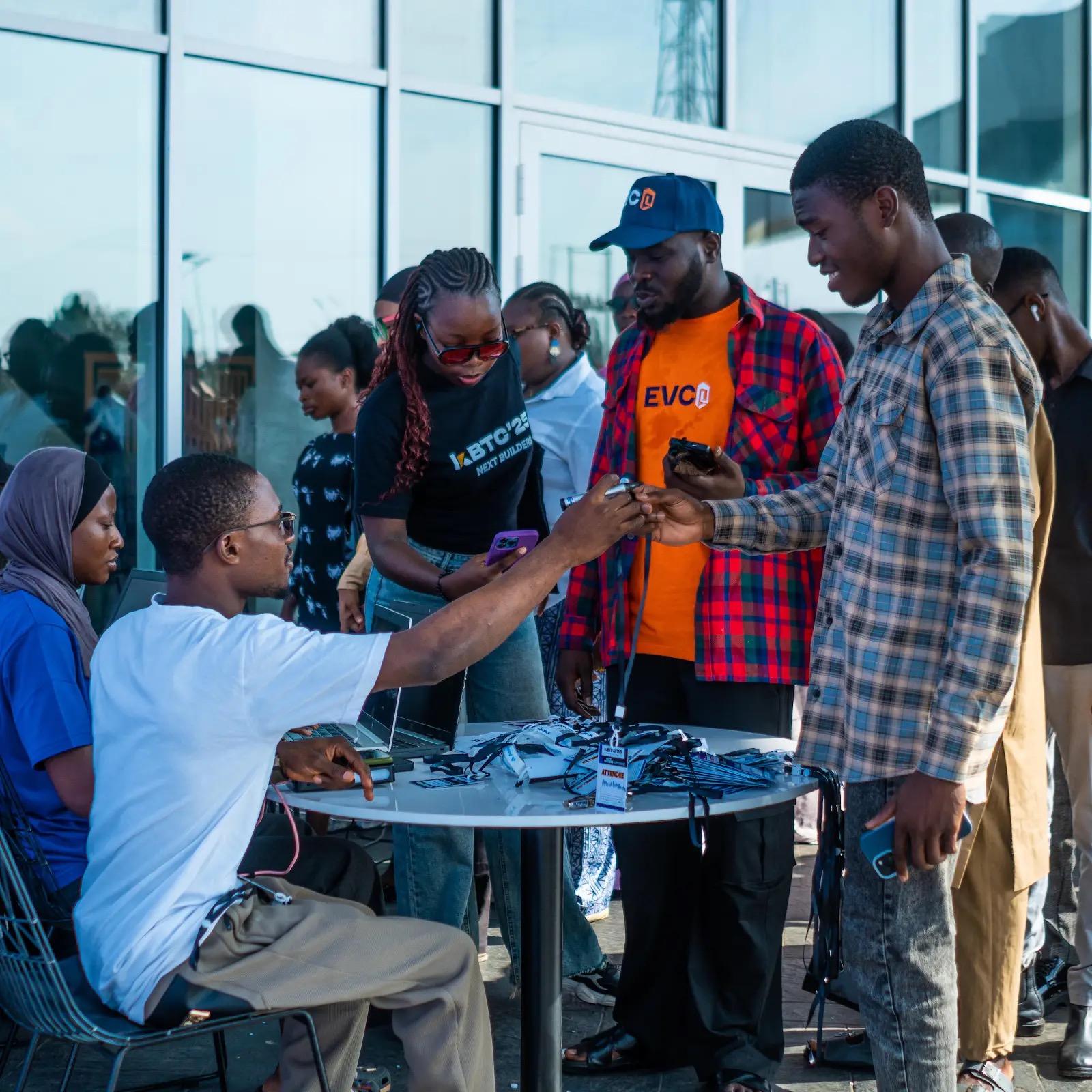 Kwarabuild attendees connecting around a registration table